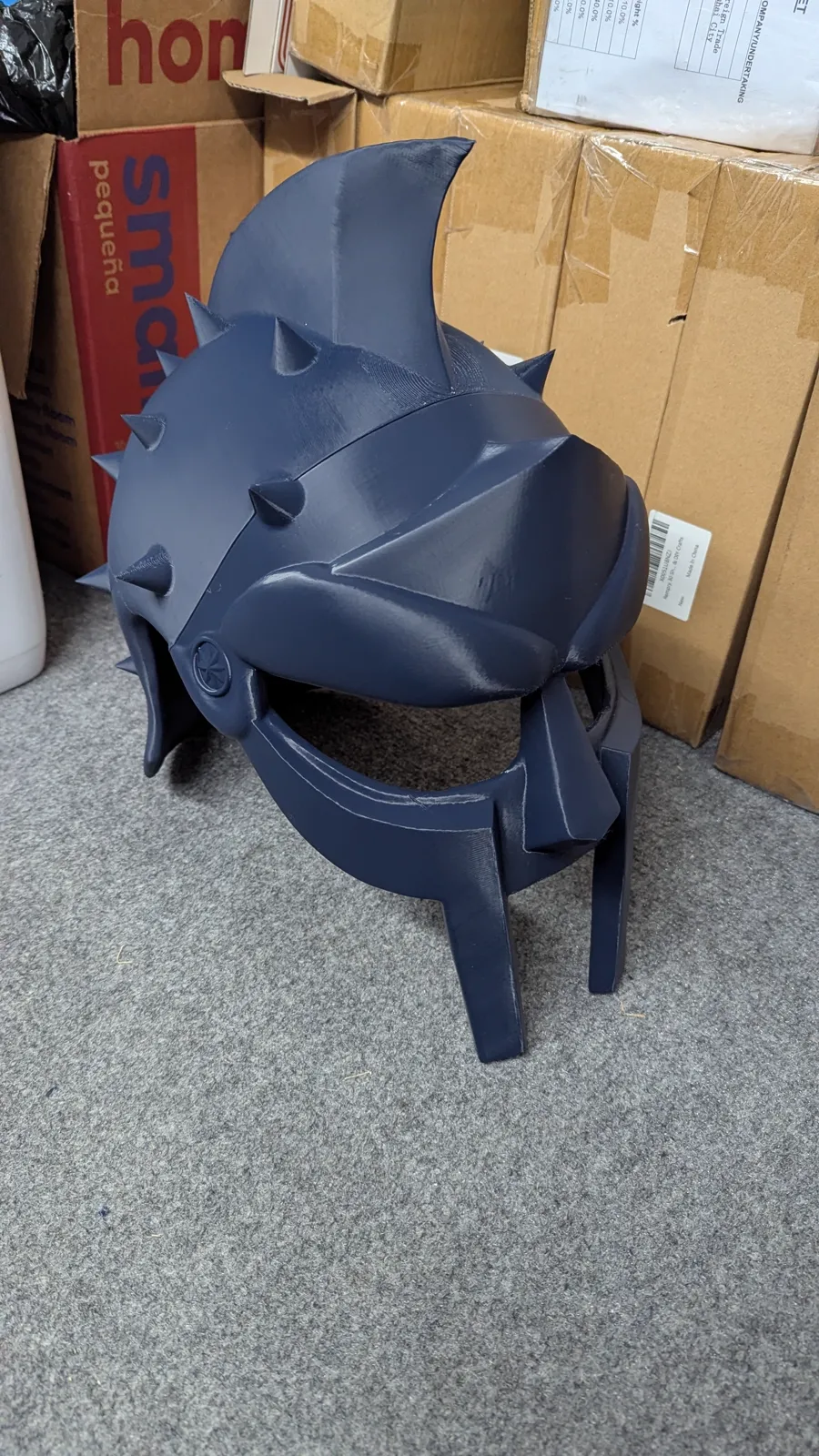 Filament (FDM) 3D printing by Kulworks: a full-size gladiator helmet and prop armour, articulated figures, terrain and city pieces, a backlit lithophane lamp, a batch of spiral lollipop prints, game markers, functional parts, and full runs of custom awards.