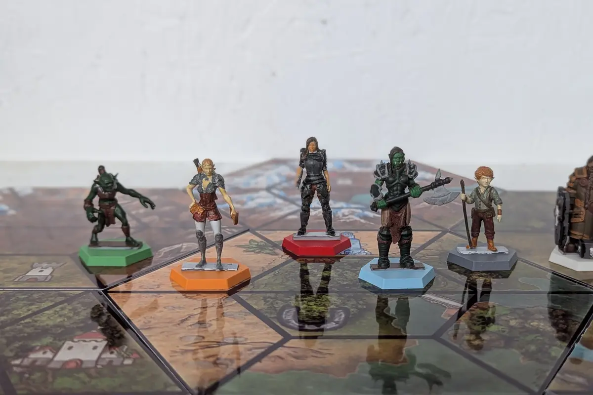 Hand-painted 3D-printed miniatures on a UV-printed hex game board